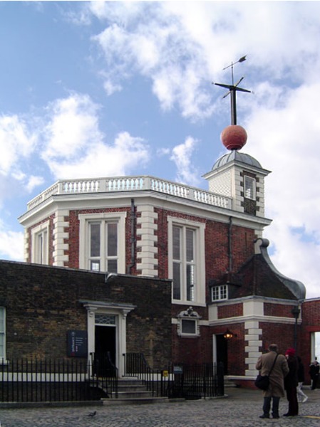 Stand on the prime meridian line at the Royal Observatory of Greenwich. 
