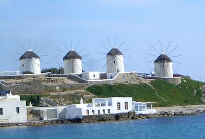 Visit Mykonos. Known for night life, windmills, and beautiful churches.